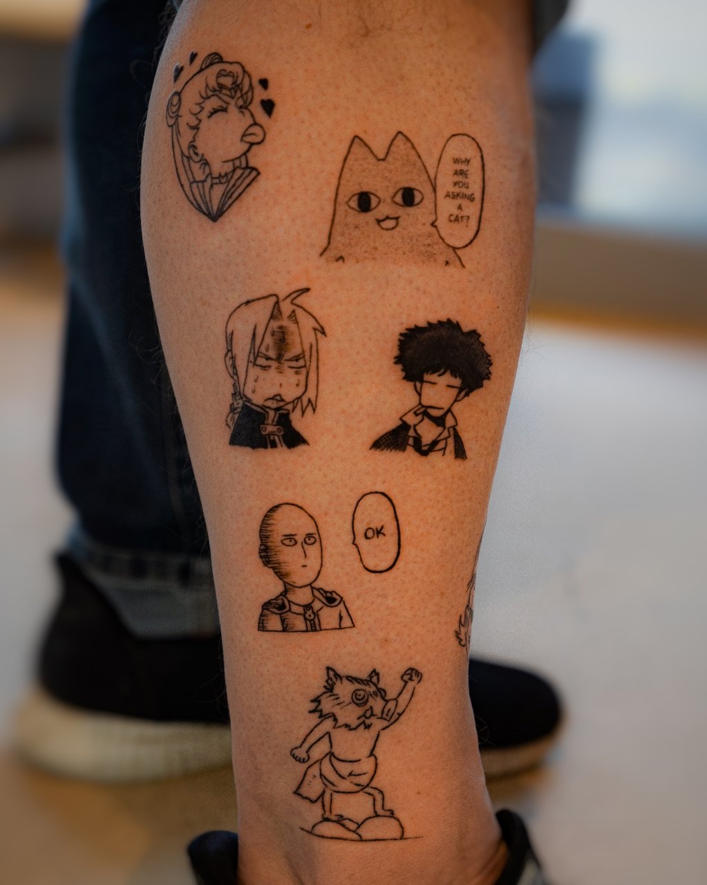 Lots of small anime tattoos