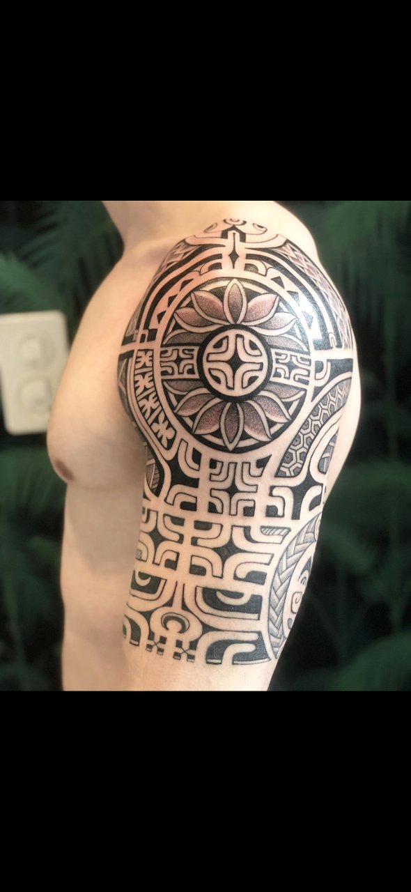 Meaningful Polynesian half sleeve 