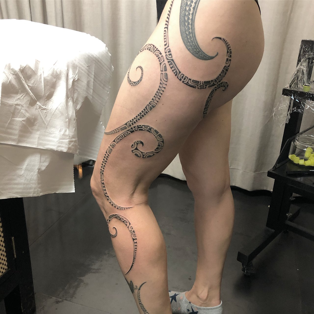 Fine line Polynesian leg tattoo