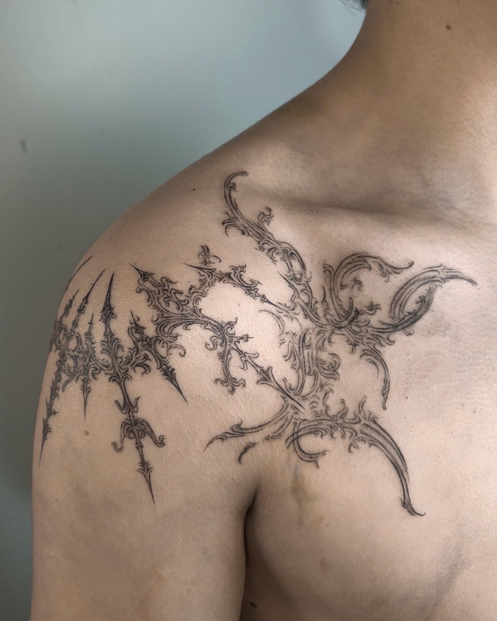 freehand on chest & custom ornament on the shoulder